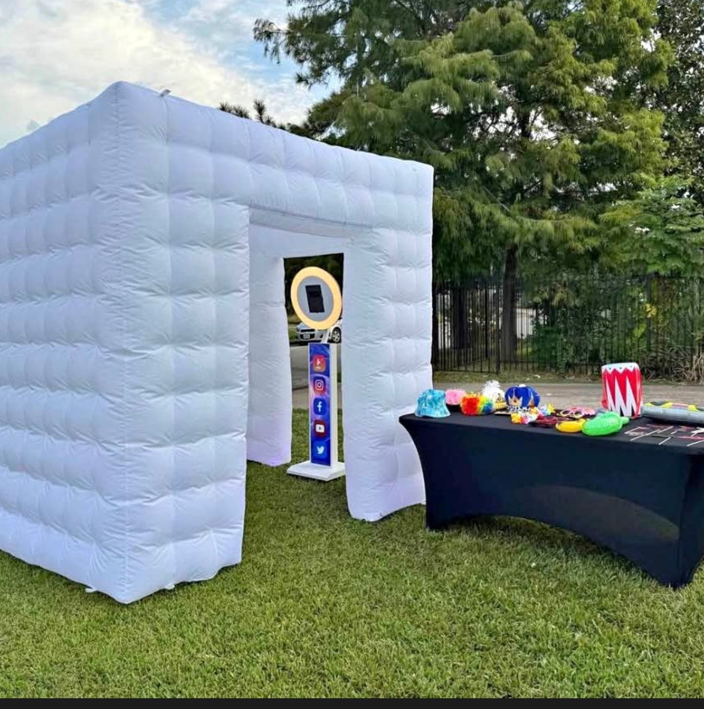 White inflatable igloo photo booth enclosure set up at an event — this photo shows our white selfie station inside